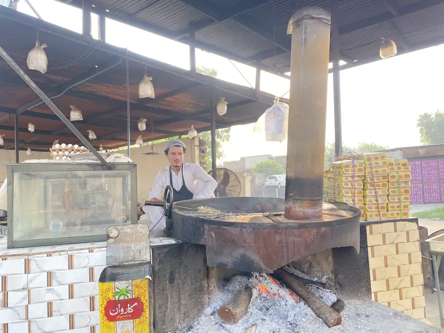 Chapli Kabab frying on the wood-fired tawa at Safdar Hotel