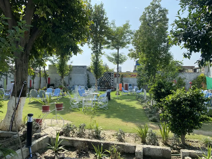 Garden seating on the lawn at Safdar Hotel Family Park in Takht Bhai